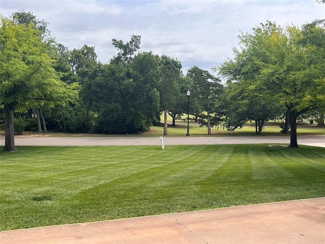 6802 NW Grand Blvd, Nichols Hills, OK 73116 - surrounding community featuring a lawn