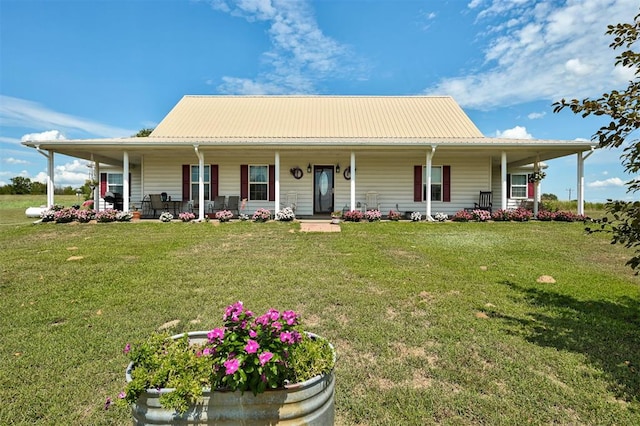 9122 Ns 3540th Rd, Prague, OK 74864 - farmhouse inspired home with metal roof, a front yard, and covered porch
