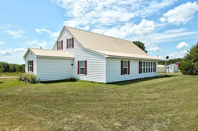 9122 Ns 3540th Rd, Prague, OK 74864 - rear view of property featuring an outbuilding, metal roof, and a lawn