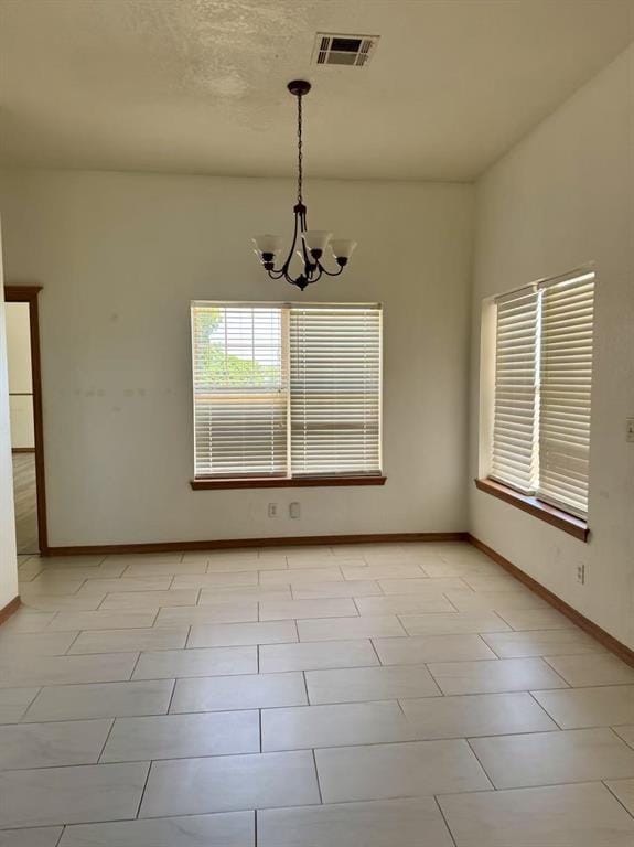 817 SW 16th St, Newcastle, OK 73065 - empty room with a chandelier and baseboards
