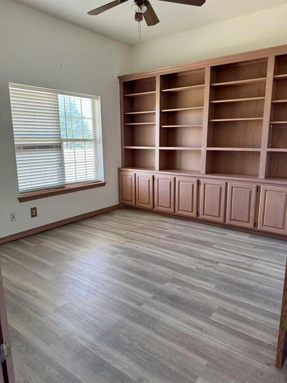 817 SW 16th St, Newcastle, OK 73065 - unfurnished room with a ceiling fan, light wood finished floors, and baseboards