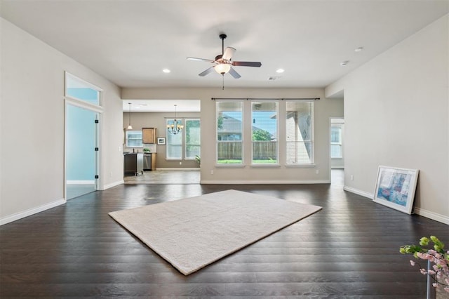 708 Havasu Dr, Norman, OK 73071 - living area with dark wood finished floors, a ceiling fan, baseboards, a chandelier, and recessed lighting