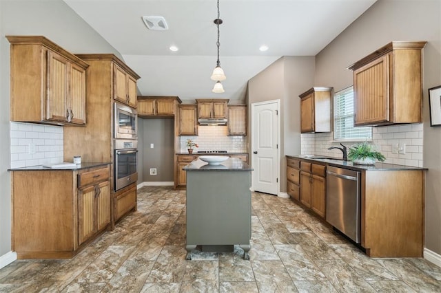 708 Havasu Dr, Norman, OK 73071 - kitchen with stainless steel appliances, brown cabinets, tasteful backsplash, a sink, and a center island