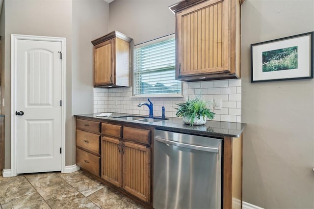 708 Havasu Dr, Norman, OK 73071 - kitchen featuring dishwasher, a sink, backsplash, dark stone countertops, and brown cabinets