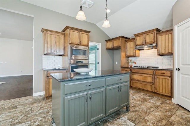 708 Havasu Dr, Norman, OK 73071 - kitchen featuring stainless steel appliances, lofted ceiling, tasteful backsplash, pendant lighting, and under cabinet range hood
