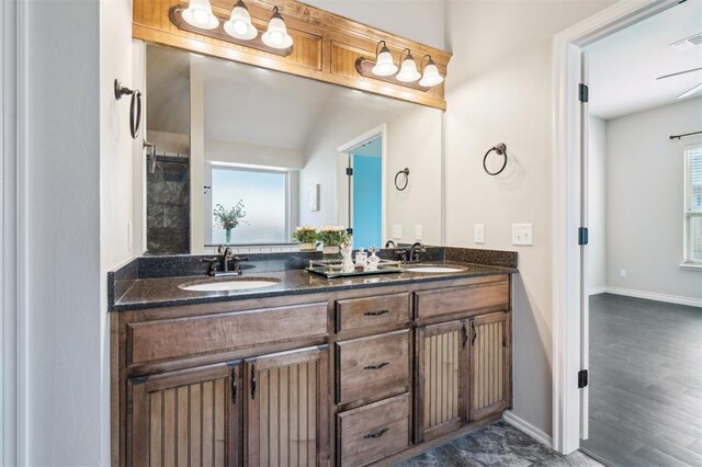 708 Havasu Dr, Norman, OK 73071 - full bath featuring double vanity, baseboards, and wood finished floors