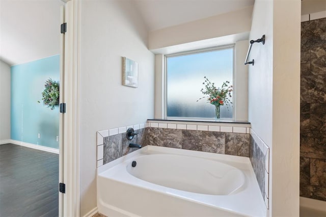 708 Havasu Dr, Norman, OK 73071 - bathroom with a garden tub and baseboards