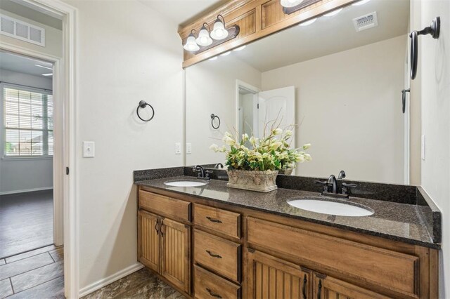 708 Havasu Dr, Norman, OK 73071 - full bath featuring double vanity and baseboards