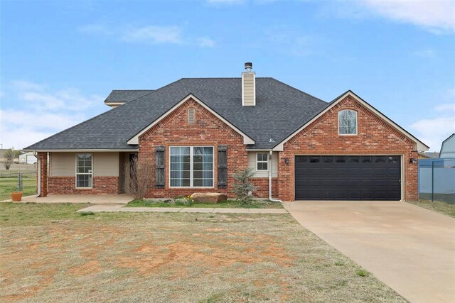 3311 Terrace Hills Rd, Piedmont, OK 73078 - traditional-style home with brick siding, concrete driveway, and roof with shingles