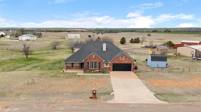 3311 Terrace Hills Rd, Piedmont, OK 73078 - view of front facade with driveway, a chimney, fence, brick siding, and a rural view