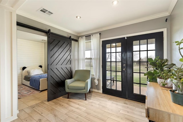 3311 Terrace Hills Rd, Piedmont, OK 73078 - living area featuring a wealth of natural light, visible vents, a barn door, and french doors