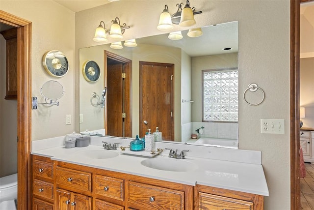 3311 Terrace Hills Rd, Piedmont, OK 73078 - bathroom with double vanity, toilet, a sink, and a chandelier
