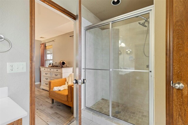 3311 Terrace Hills Rd, Piedmont, OK 73078 - bathroom featuring a shower stall, wood finished floors, and vanity