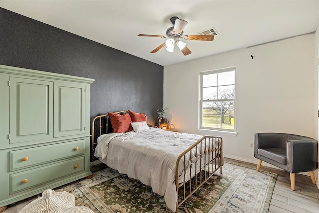 3311 Terrace Hills Rd, Piedmont, OK 73078 - bedroom featuring baseboards, ceiling fan, visible vents, and light wood finished floors