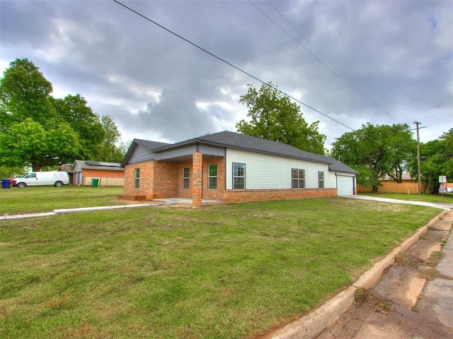 3100 NE 17th St, Oklahoma City, OK 73121 - view of property exterior with driveway, a lawn, and a garage