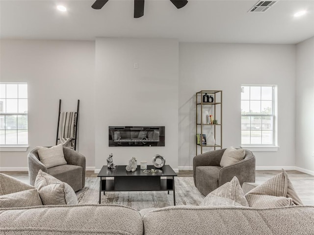 3100 NE 17th St, Oklahoma City, OK 73121 - living room featuring baseboards, wood finished floors, a ceiling fan, and recessed lighting