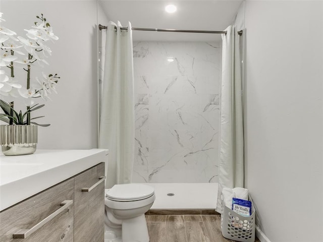 3100 NE 17th St, Oklahoma City, OK 73121 - full bath with wood finished floors, toilet, a shower stall, and vanity