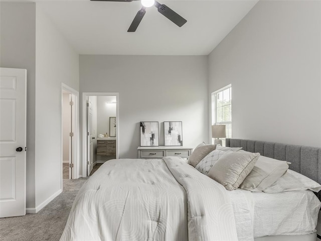 3100 NE 17th St, Oklahoma City, OK 73121 - carpeted bedroom featuring baseboards, ceiling fan, and ensuite bath