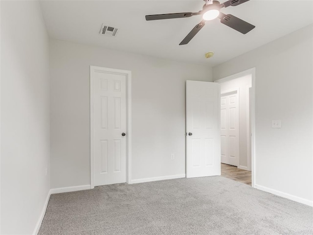 3100 NE 17th St, Oklahoma City, OK 73121 - unfurnished bedroom with light colored carpet, baseboards, and a ceiling fan