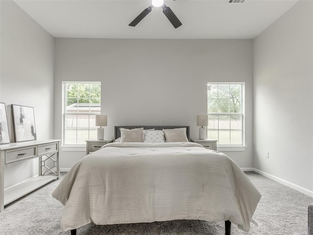 3100 NE 17th St, Oklahoma City, OK 73121 - bedroom featuring carpet flooring, multiple windows, baseboards, and ceiling fan