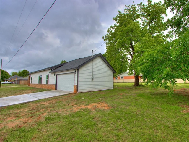 3100 NE 17th St, Oklahoma City, OK 73121 - view of side of home with concrete driveway and brick siding