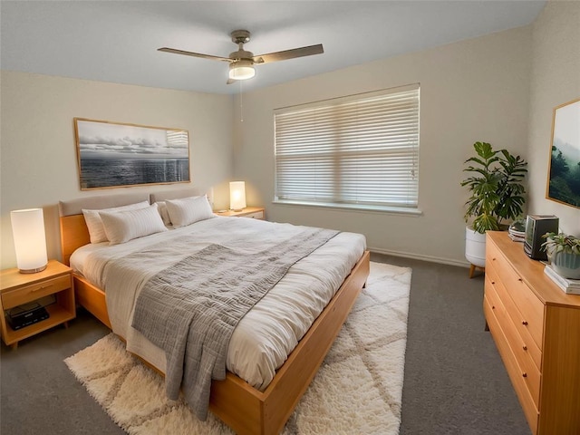bedroom with carpet, baseboards, and ceiling fan