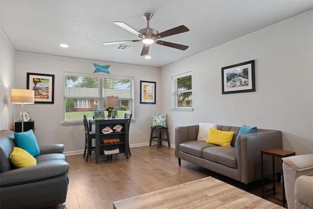 3101 NW 70th St, Oklahoma City, OK 73116 - living room featuring a ceiling fan, wood finished floors, baseboards, visible vents, and recessed lighting
