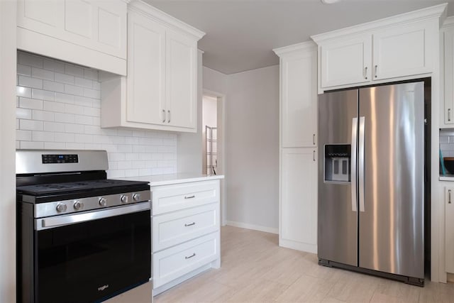 3101 NW 70th St, Oklahoma City, OK 73116 - kitchen with tasteful backsplash, light countertops, appliances with stainless steel finishes, and white cabinets