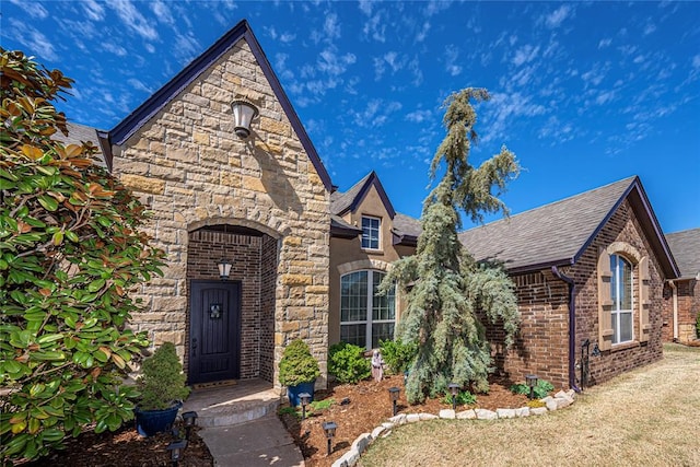 8301 NW 146th St, Oklahoma City, OK 73142 - tudor house with stone siding and roof with shingles