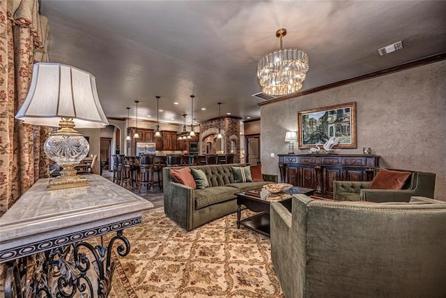 8301 NW 146th St, Oklahoma City, OK 73142 - living area featuring arched walkways, ornamental molding, visible vents, and an inviting chandelier