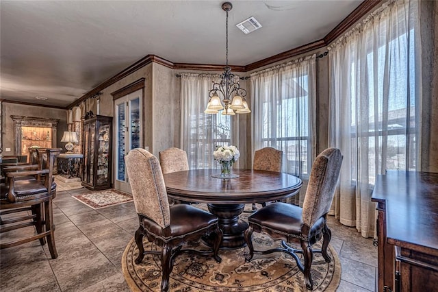 8301 NW 146th St, Oklahoma City, OK 73142 - dining area with a notable chandelier, visible vents, and ornamental molding