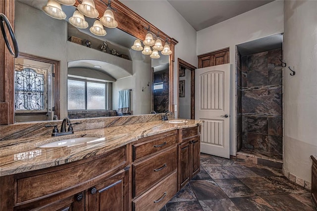 8301 NW 146th St, Oklahoma City, OK 73142 - bathroom featuring double vanity, tiled shower, and a sink