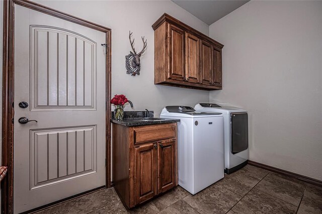 8301 NW 146th St, Oklahoma City, OK 73142 - washroom featuring baseboards, separate washer and dryer, and cabinet space