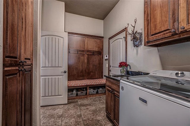 8301 NW 146th St, Oklahoma City, OK 73142 - clothes washing area featuring tile patterned flooring, a sink, cabinet space, and washer / dryer