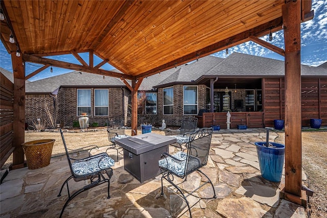 8301 NW 146th St, Oklahoma City, OK 73142 - view of patio featuring a fire pit