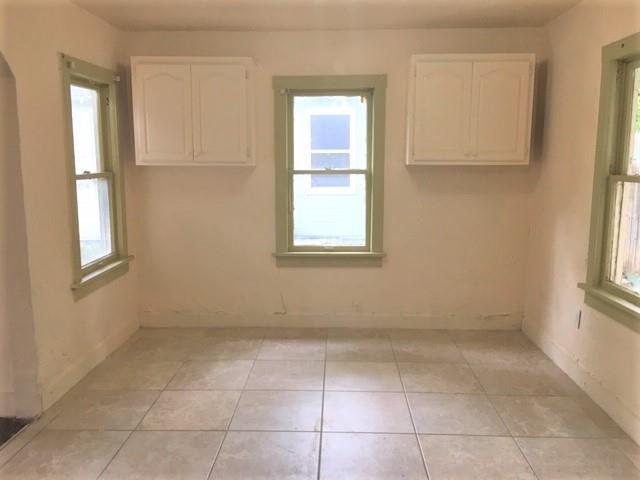 2921 NW 12th St, Oklahoma City, OK 73107 - unfurnished room featuring light tile patterned floors