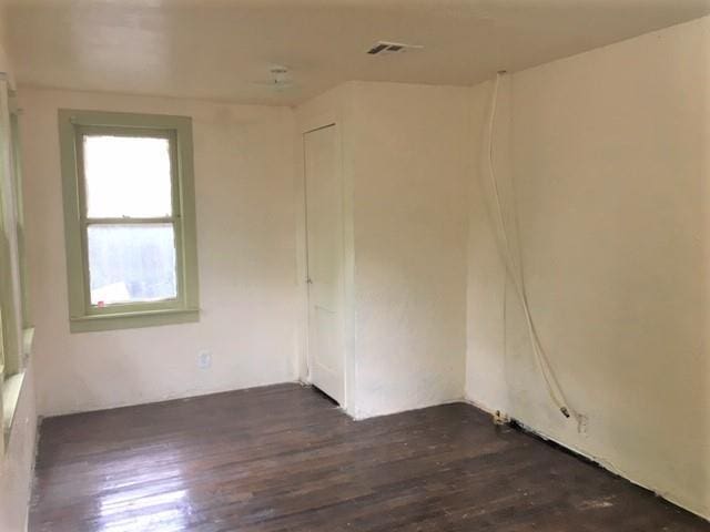 2921 NW 12th St, Oklahoma City, OK 73107 - empty room featuring visible vents and dark wood finished floors