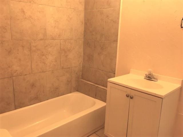 2921 NW 12th St, Oklahoma City, OK 73107 - full bathroom with tile patterned floors and vanity
