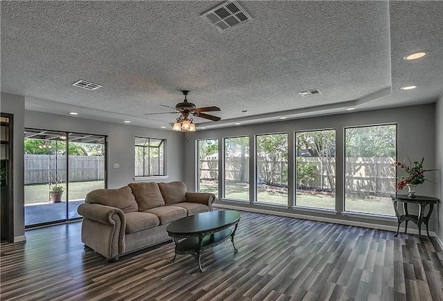 2325 NW 119th St, Oklahoma City, OK 73120 - living room featuring ceiling fan, visible vents, and dark wood finished floors