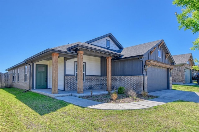 13412 Arrowhead Blvd, Yukon, OK 73099 - view of front facade with brick siding, concrete driveway, a garage, a front yard, and board and batten siding