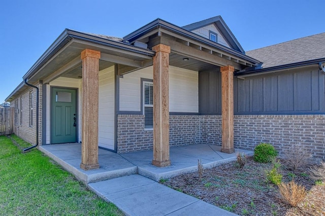 13412 Arrowhead Blvd, Yukon, OK 73099 - view of front facade featuring board and batten siding and brick siding