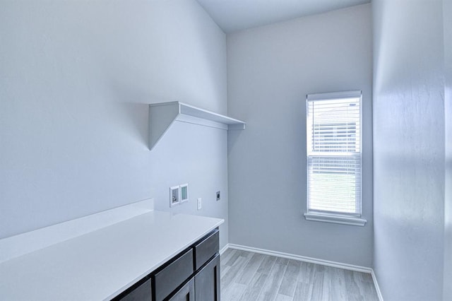 13412 Arrowhead Blvd, Yukon, OK 73099 - washroom featuring light wood-type flooring, electric dryer hookup, a wealth of natural light, and hookup for a washing machine