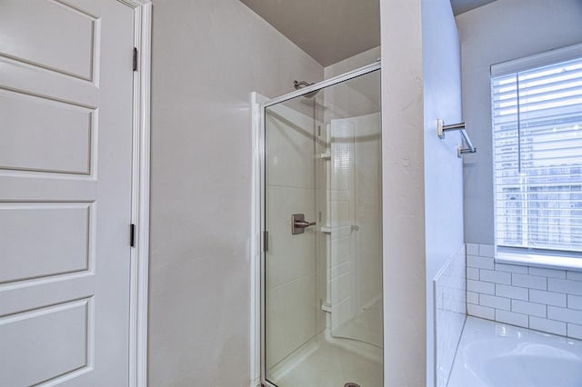 13412 Arrowhead Blvd, Yukon, OK 73099 - bathroom featuring a stall shower and a bath