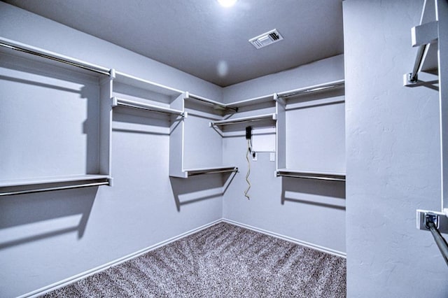 13412 Arrowhead Blvd, Yukon, OK 73099 - walk in closet featuring carpet flooring and visible vents
