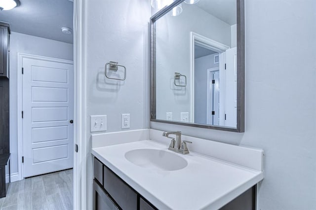 13412 Arrowhead Blvd, Yukon, OK 73099 - bathroom with vanity and wood finished floors