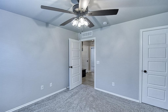 13412 Arrowhead Blvd, Yukon, OK 73099 - unfurnished bedroom featuring ceiling fan, carpet flooring, baseboards, and visible vents