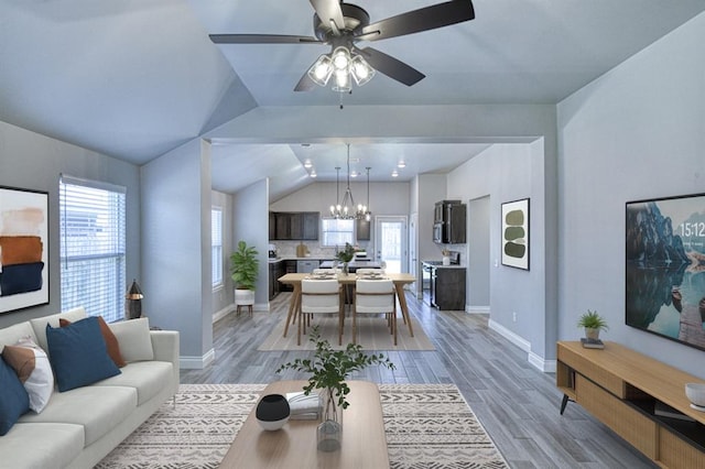 13412 Arrowhead Blvd, Yukon, OK 73099 - living room with baseboards, lofted ceiling, and a healthy amount of sunlight