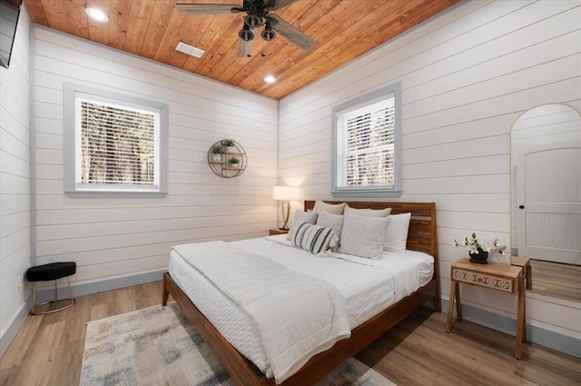 203 Secluded Cir, Broken Bow, OK 74728 - bedroom featuring wooden ceiling, wood finished floors, wood walls, recessed lighting, and a ceiling fan