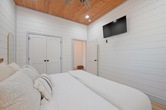 203 Secluded Cir, Broken Bow, OK 74728 - bedroom featuring wooden ceiling, wooden walls, a closet, and recessed lighting