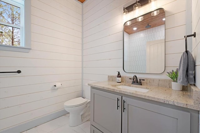203 Secluded Cir, Broken Bow, OK 74728 - bathroom with vanity, wooden walls, and marble look tiles